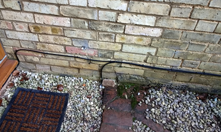 external cat5e ethernet cabling buried under drive in hitchin hertfordshire