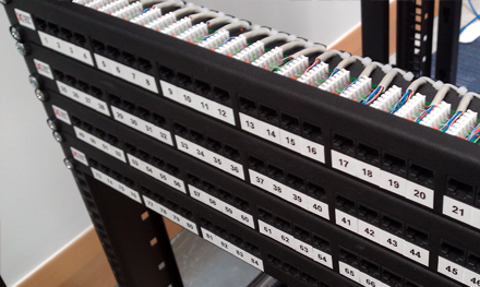 cat5e ethernet patch panel cable termination into coms rack in hertfordshire office