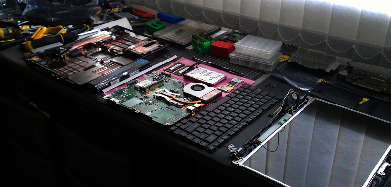 image of a laptop taken apart for repair by a laptop repair shop providing laptop screen repair in hitchin